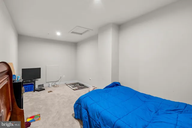 a bathroom with a sink a toilet and shower curtain