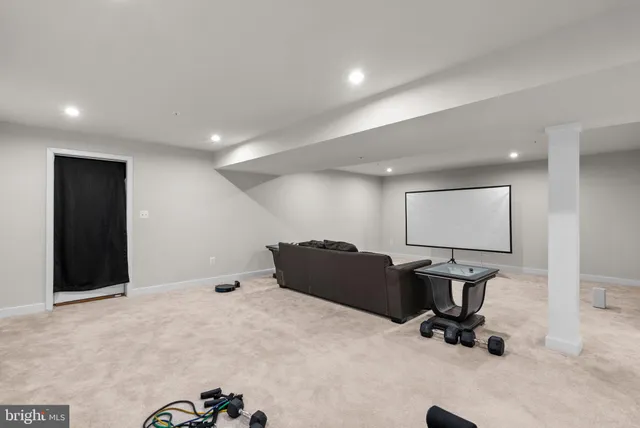a room with gym equipment and windows
