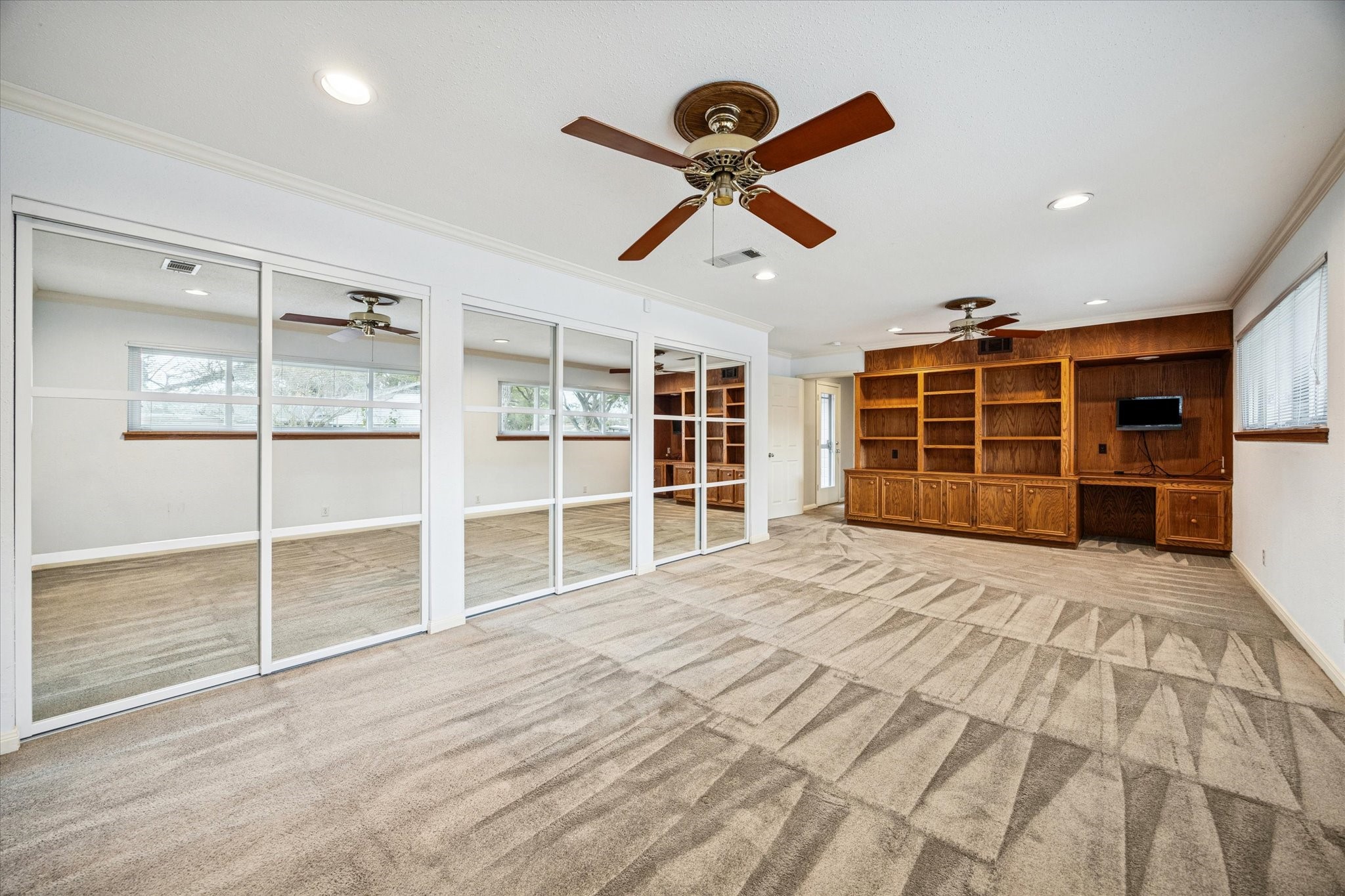 9022 Timberside Drive Houston, TX 77025 - Photo 6 of 10 a view of a bedroom with a bed and a window