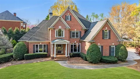 an aerial view of a house with outdoor space