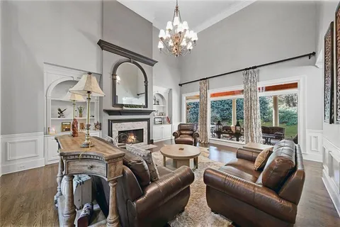 a room with gym equipment and a view of living room