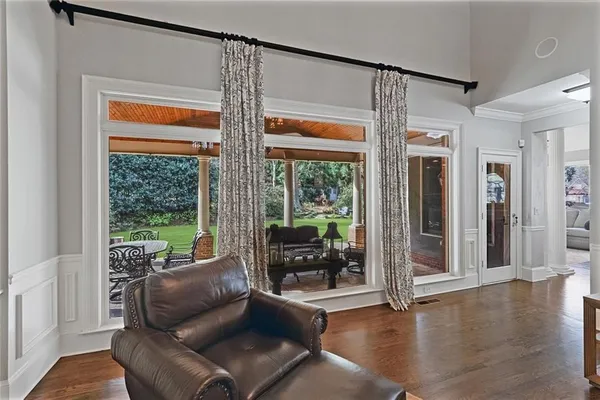 a view of a house with backyard porch and sitting area