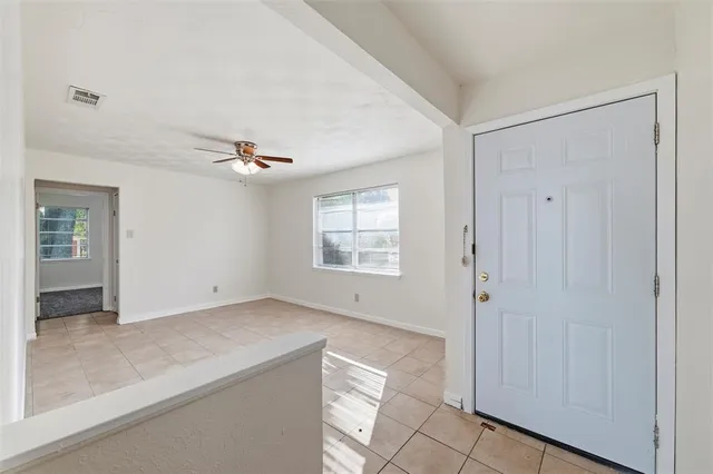 a view of an empty room with a window