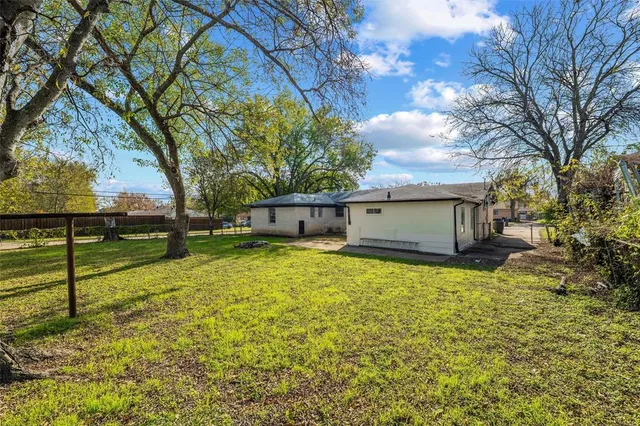 a house view with a backyard space