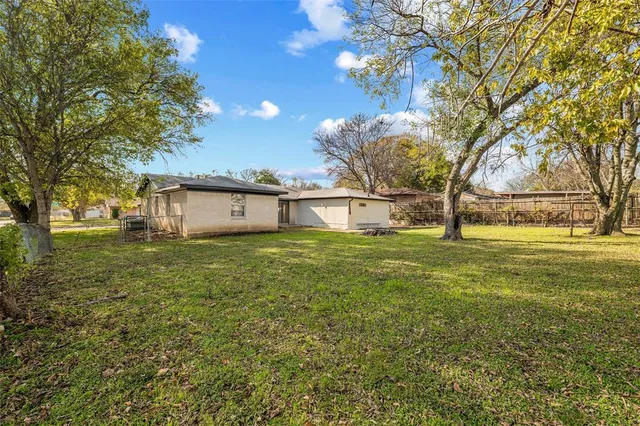 a house view with a backyard space