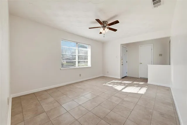 a view of an empty room and window