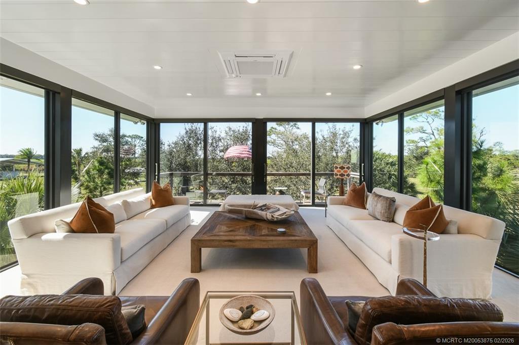 2541 Southwest Trailside Path Stuart, FL 34997 - Photo 42 of 100 a living room with furniture and a large window