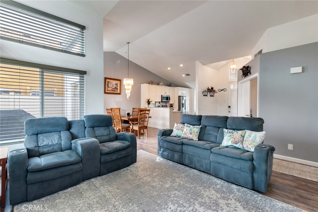 705 Fuchsia Lane Perris, CA 92571 - Photo 13 of 29 a living room with furniture and a large window