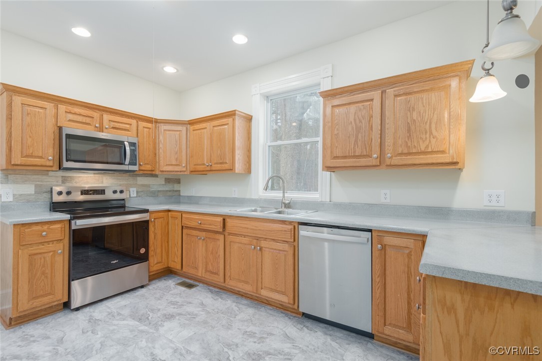 7808 Wells Road Ford, VA 23850 - Photo 29 of 41 a kitchen with sink a microwave and cabinets