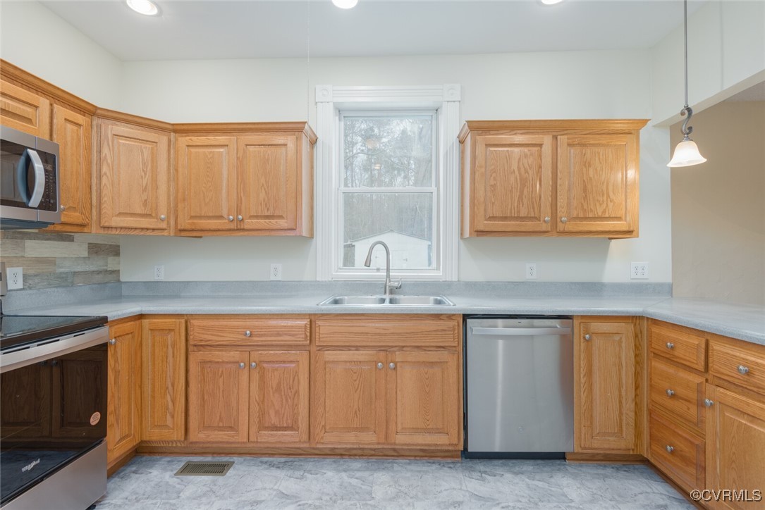 7808 Wells Road Ford, VA 23850 - Photo 30 of 41 a kitchen with white cabinets sink and dishwasher