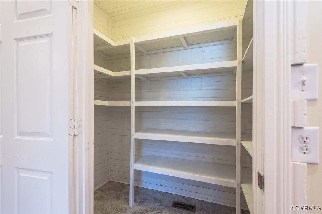 7808 Wells Road Ford, VA 23850 - Photo 33 of 41 a view of walk in closet with empty racks