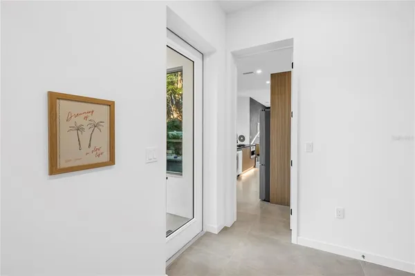 a view of a livingroom with furniture and staircase