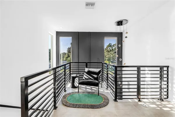 a bathroom with a sink a toilet a mirror and shower