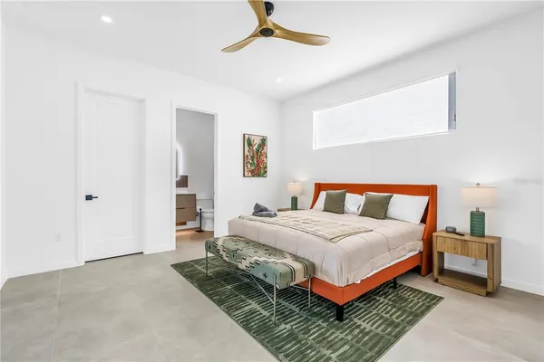 a living room with furniture and a floor to ceiling window