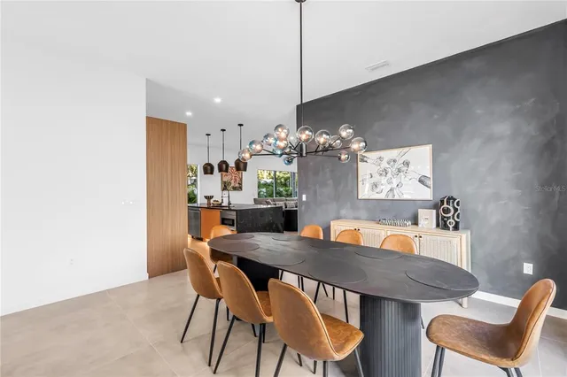 a dining room with furniture and window