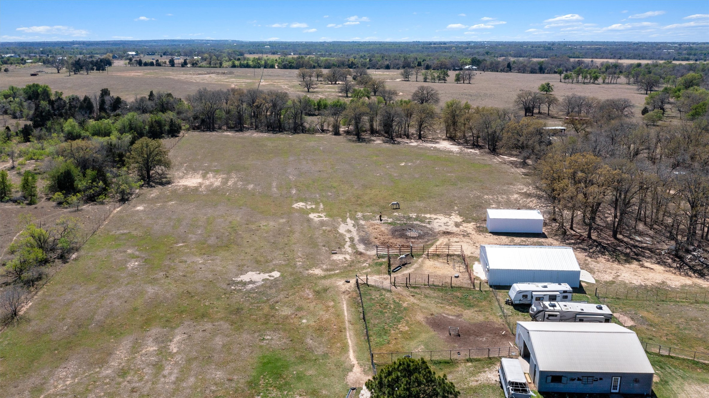 359 North County Line Road Elgin, TX 78621 - Photo 14 of 24 an aerial view of a house with a lake view
