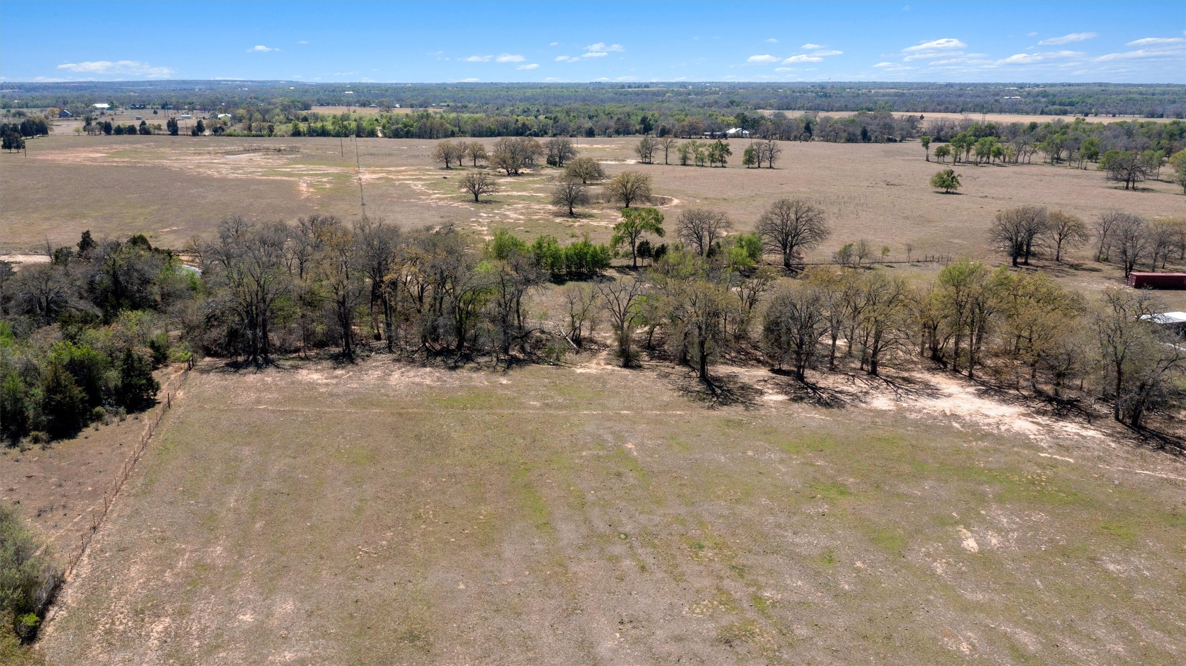 359 North County Line Road Elgin, TX 78621 - Photo 18 of 24 a view of a lake with houses in the back