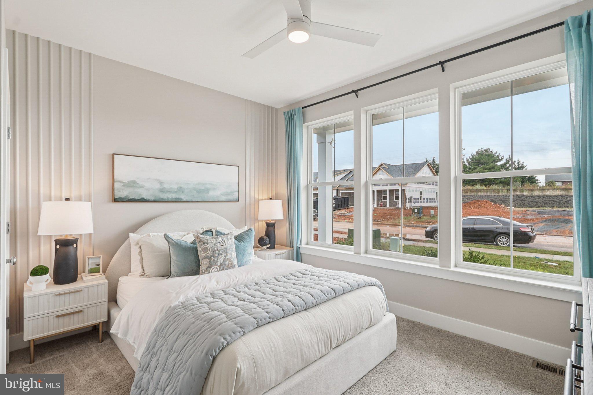 111 Hydrangea Way Winchester, VA 22602 - Photo 25 of 46 a bedroom with a large bed and a large window