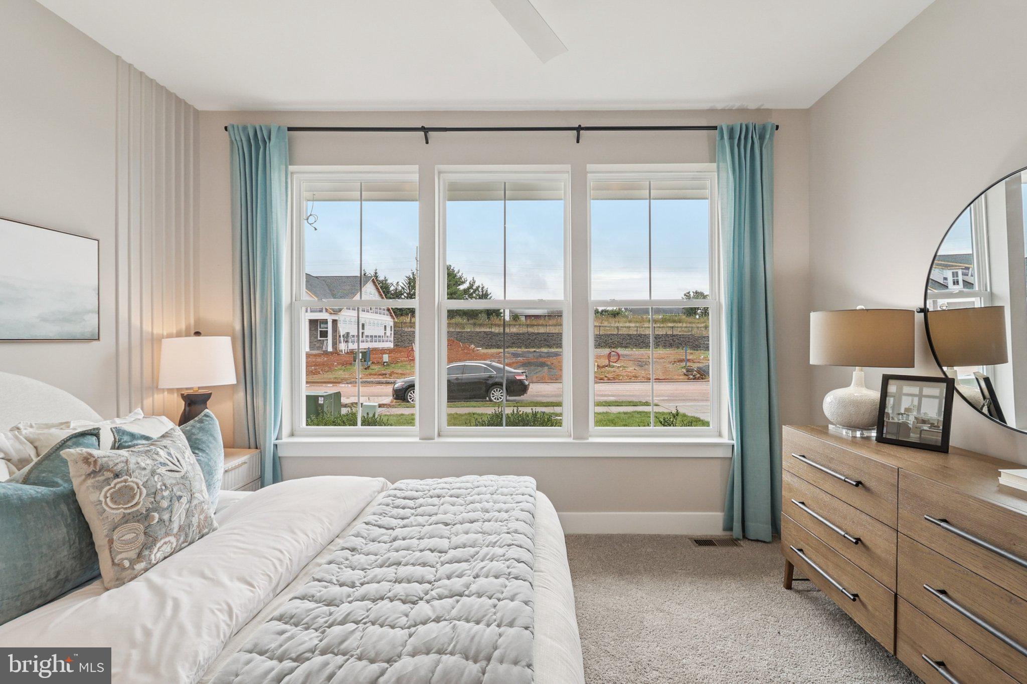 111 Hydrangea Way Winchester, VA 22602 - Photo 26 of 46 a bedroom with a bed and large window