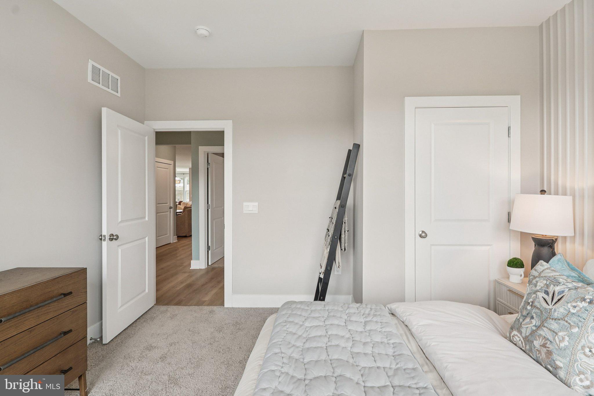 111 Hydrangea Way Winchester, VA 22602 - Photo 28 of 46 a bedroom with a bed and a couch
