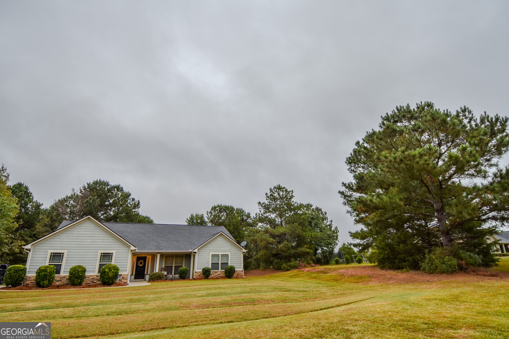 1946 Highway 362 Williamson, GA 30292 - Photo 13 of 104 a front view of house with yard and green space