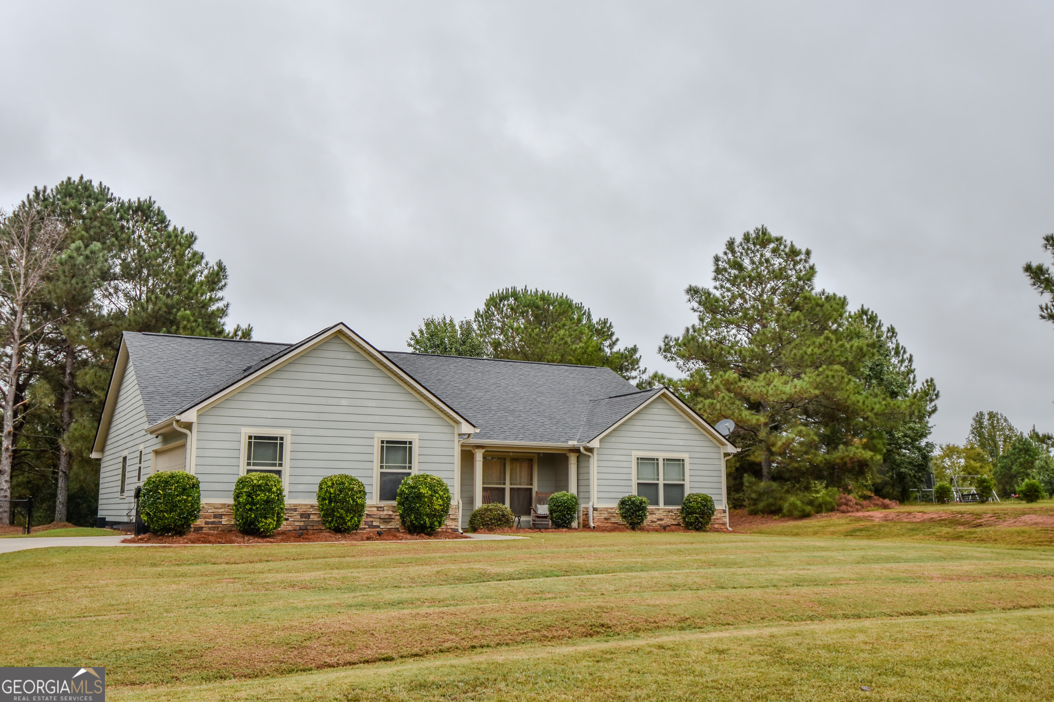 1946 Highway 362 Williamson, GA 30292 - Photo 16 of 104 a front view of a house with a yard