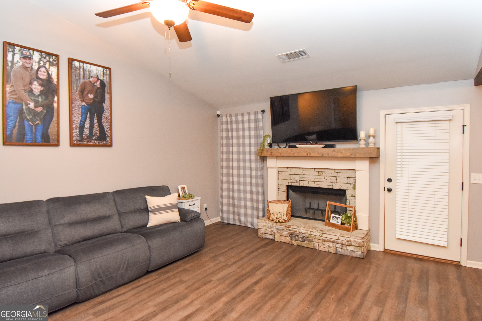 1946 Highway 362 Williamson, GA 30292 - Photo 37 of 104 a living room with furniture a flat screen tv and a fireplace