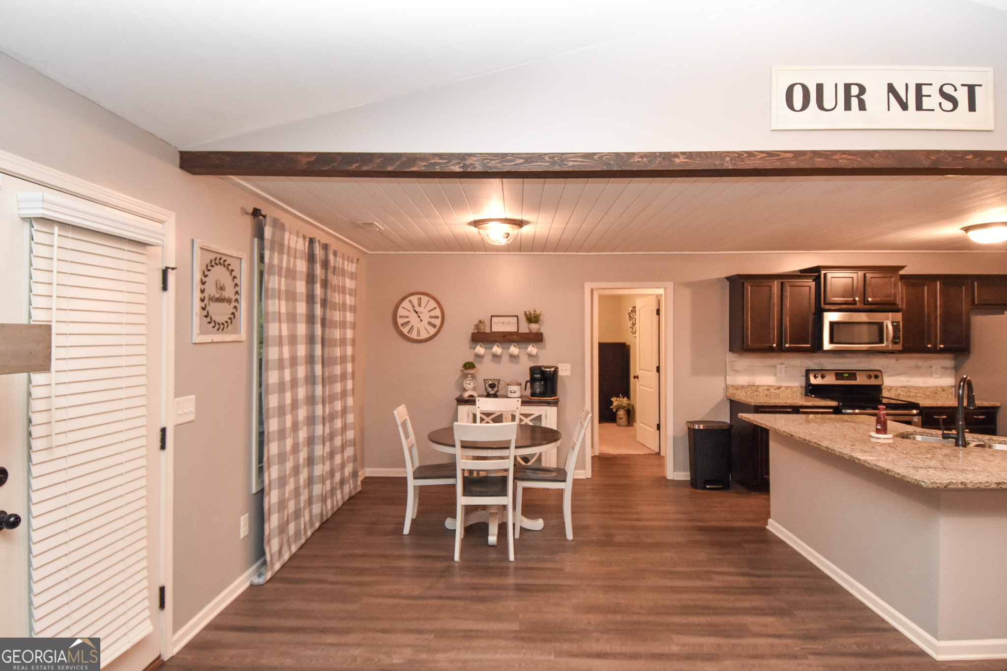 1946 Highway 362 Williamson, GA 30292 - Photo 52 of 104 a kitchen with stainless steel appliances kitchen island granite countertop a sink and cabinets