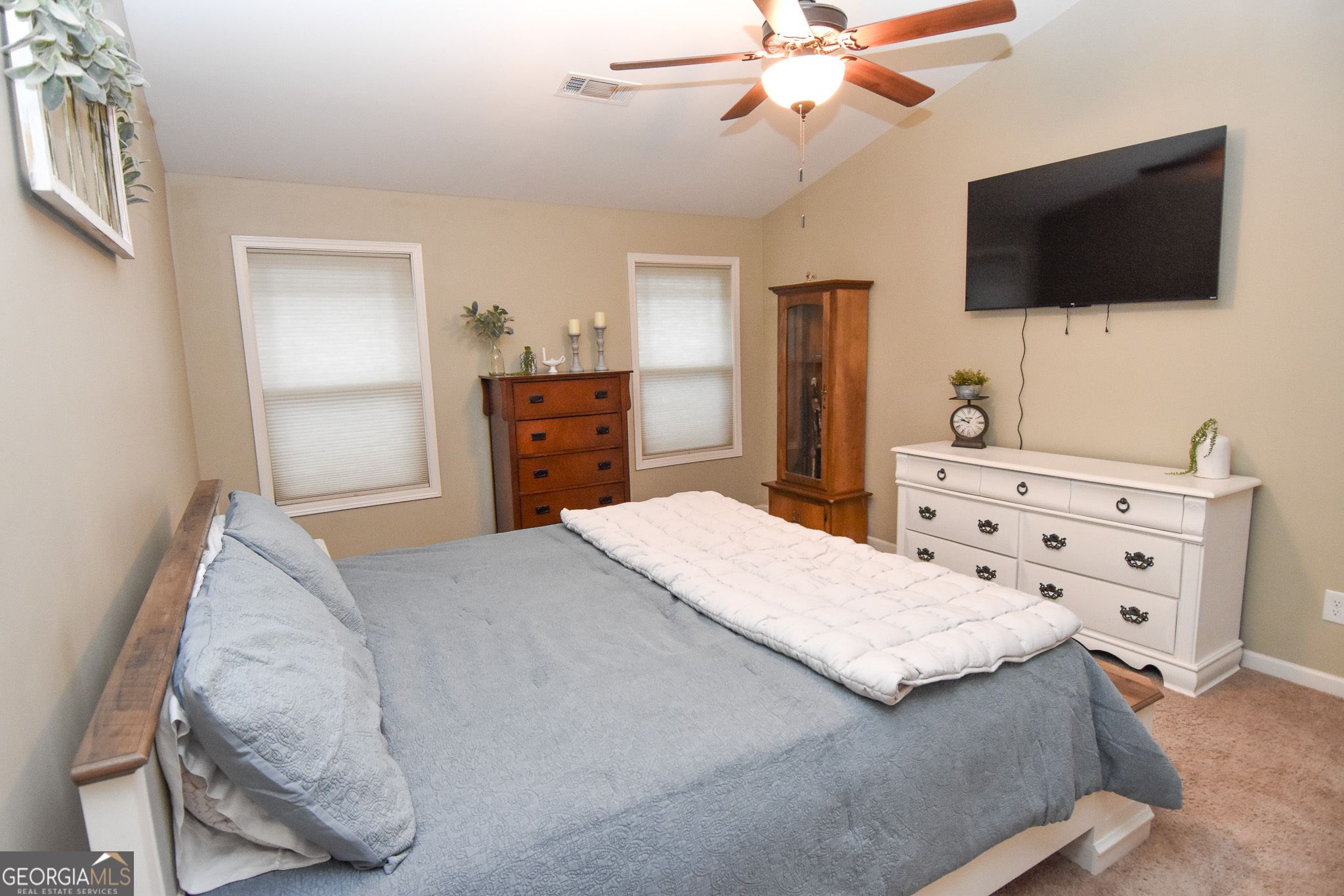 1946 Highway 362 Williamson, GA 30292 - Photo 59 of 104 a bedroom with a bed and a flat screen tv