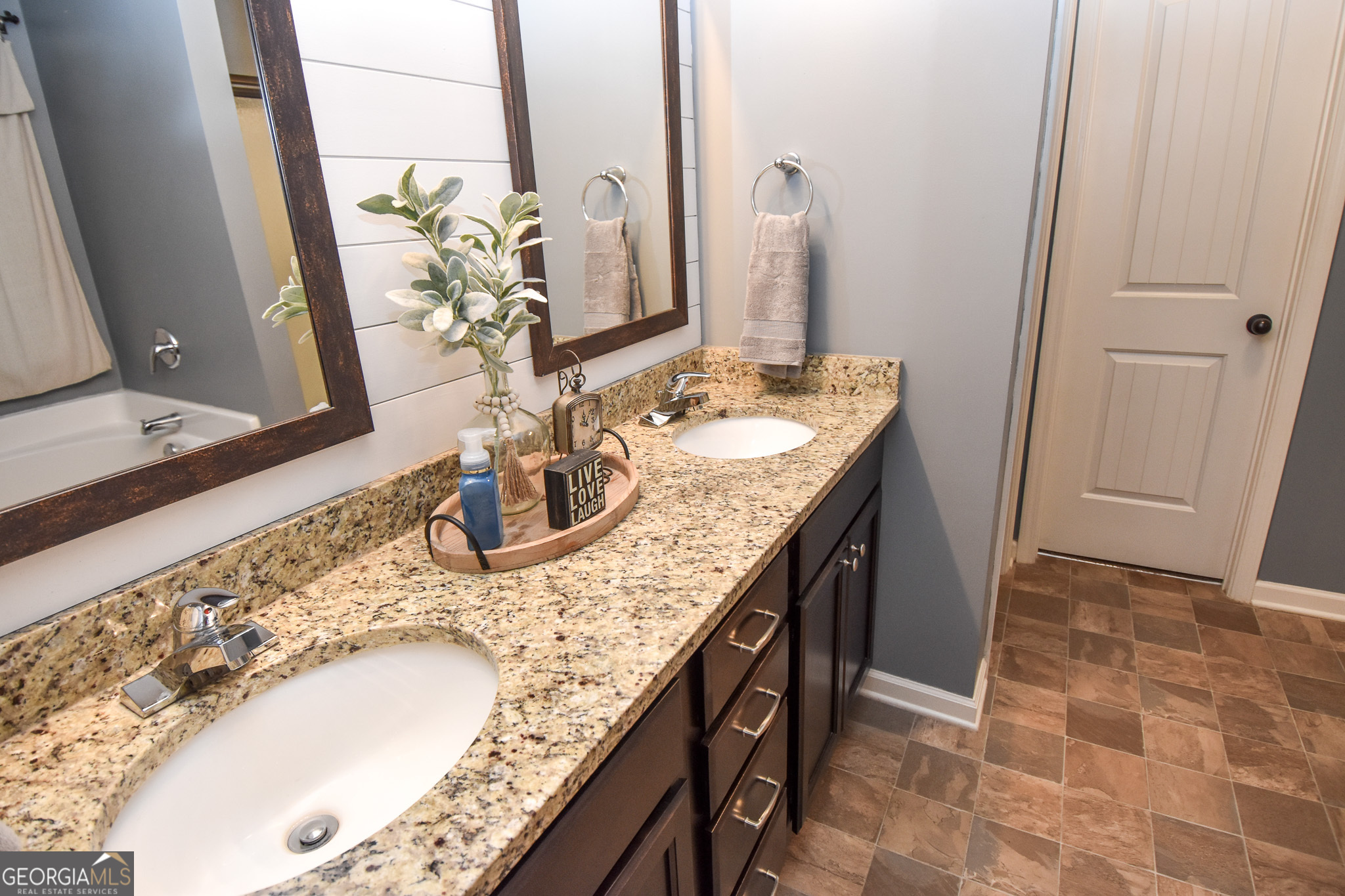 1946 Highway 362 Williamson, GA 30292 - Photo 63 of 104 a bathroom with a granite countertop sink a mirror and vanity