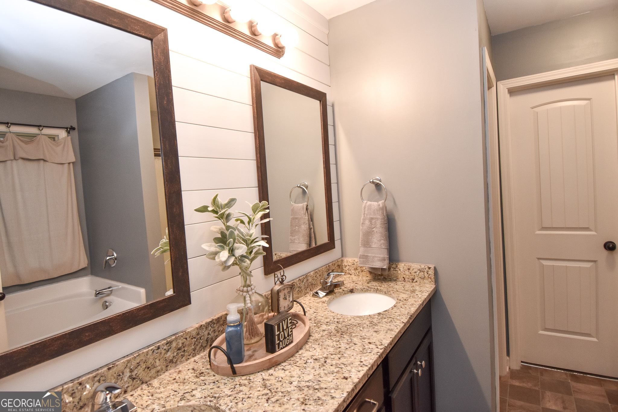 1946 Highway 362 Williamson, GA 30292 - Photo 71 of 104 a bathroom with a granite countertop sink a mirror and a shower