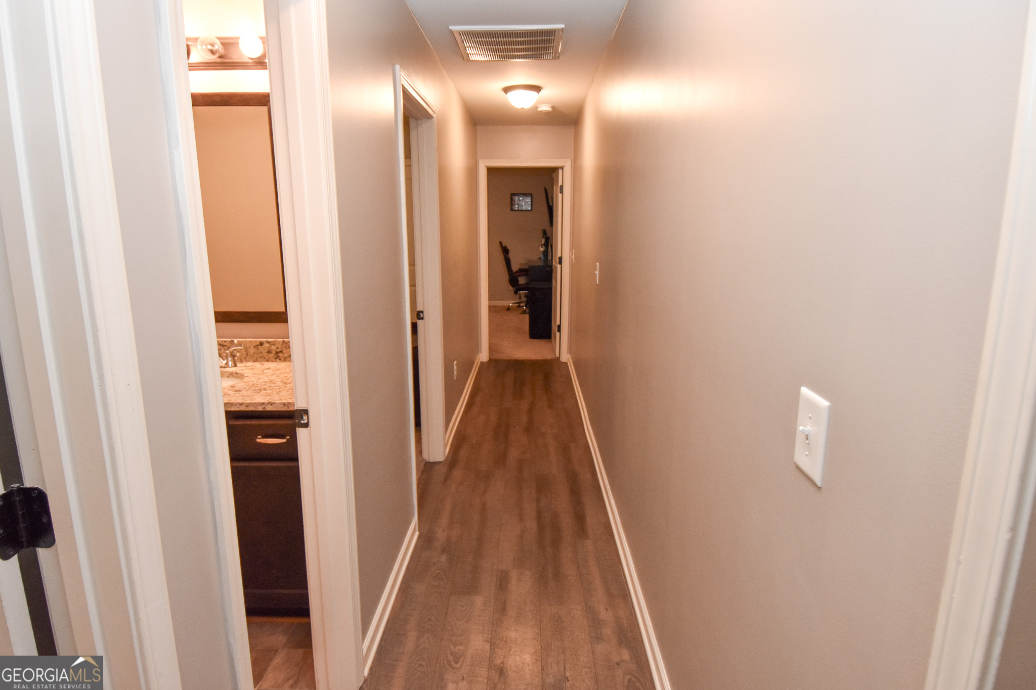 1946 Highway 362 Williamson, GA 30292 - Photo 74 of 104 a view of a hallway with wooden floor