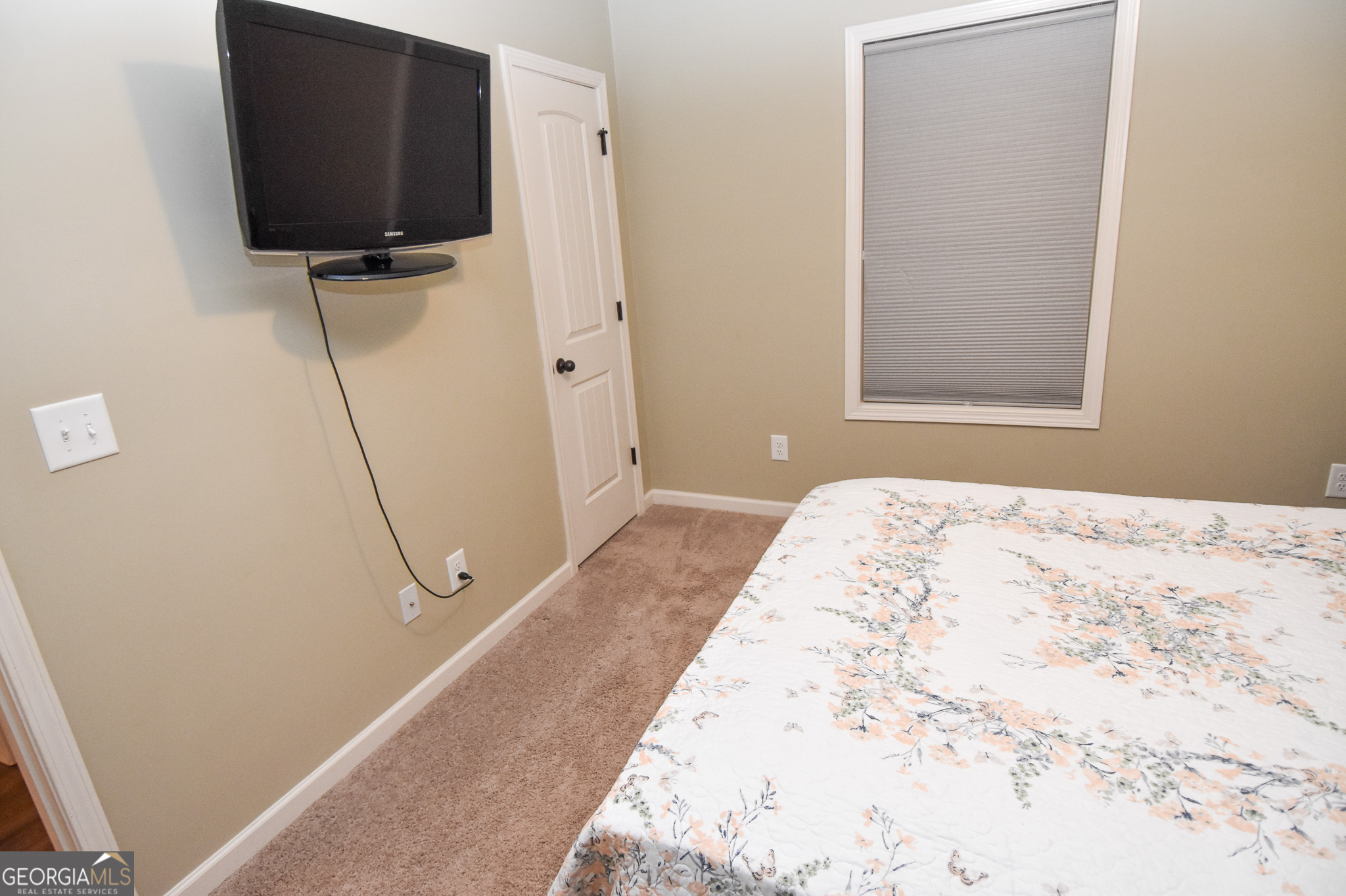 1946 Highway 362 Williamson, GA 30292 - Photo 76 of 104 a bedroom with a bed and flat screen tv