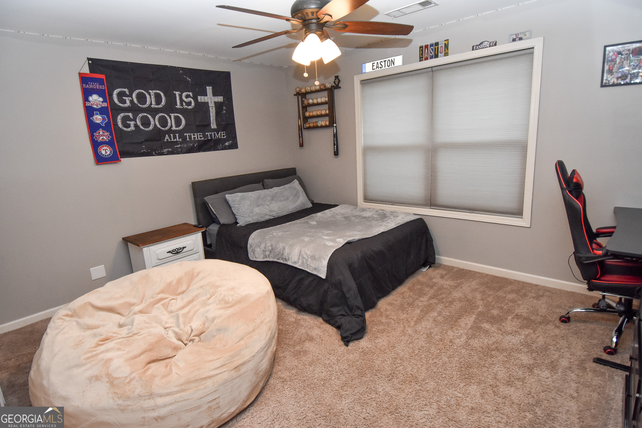 1946 Highway 362 Williamson, GA 30292 - Photo 79 of 104 a bedroom with a bed and a chandelier