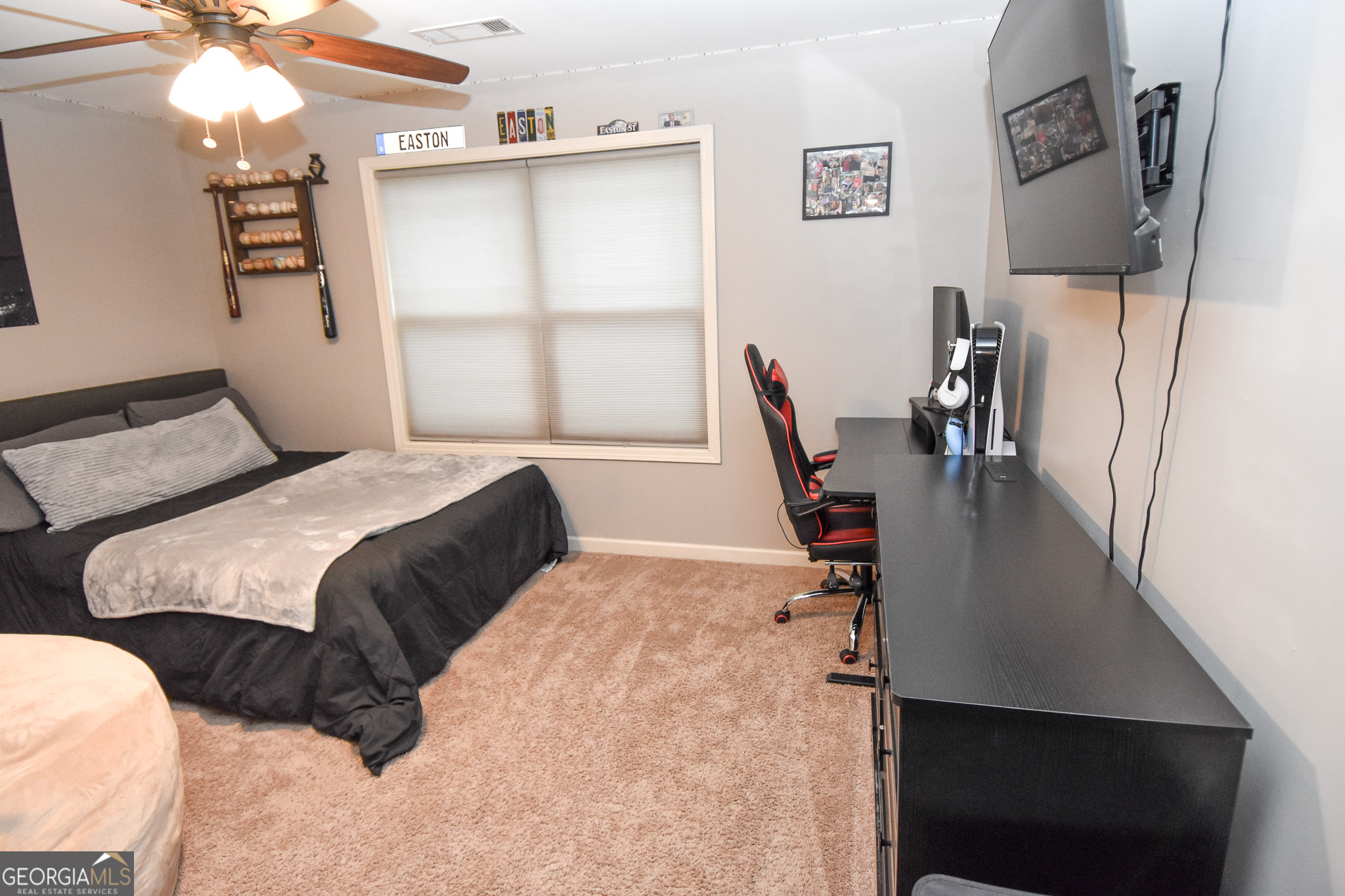 1946 Highway 362 Williamson, GA 30292 - Photo 80 of 104 a bedroom with a bed and a flat tv screen on the dresser