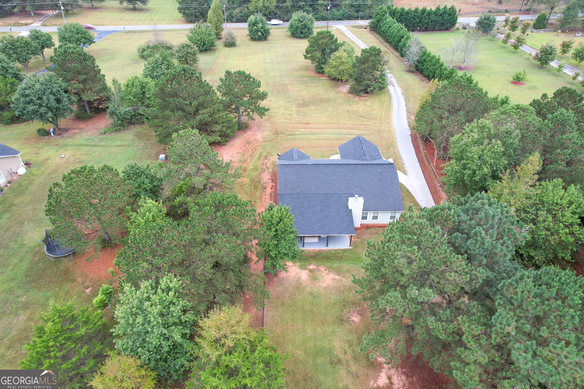 1946 Highway 362 Williamson, GA 30292 - Photo 9 of 104 an aerial view of a house with a yard and lake view