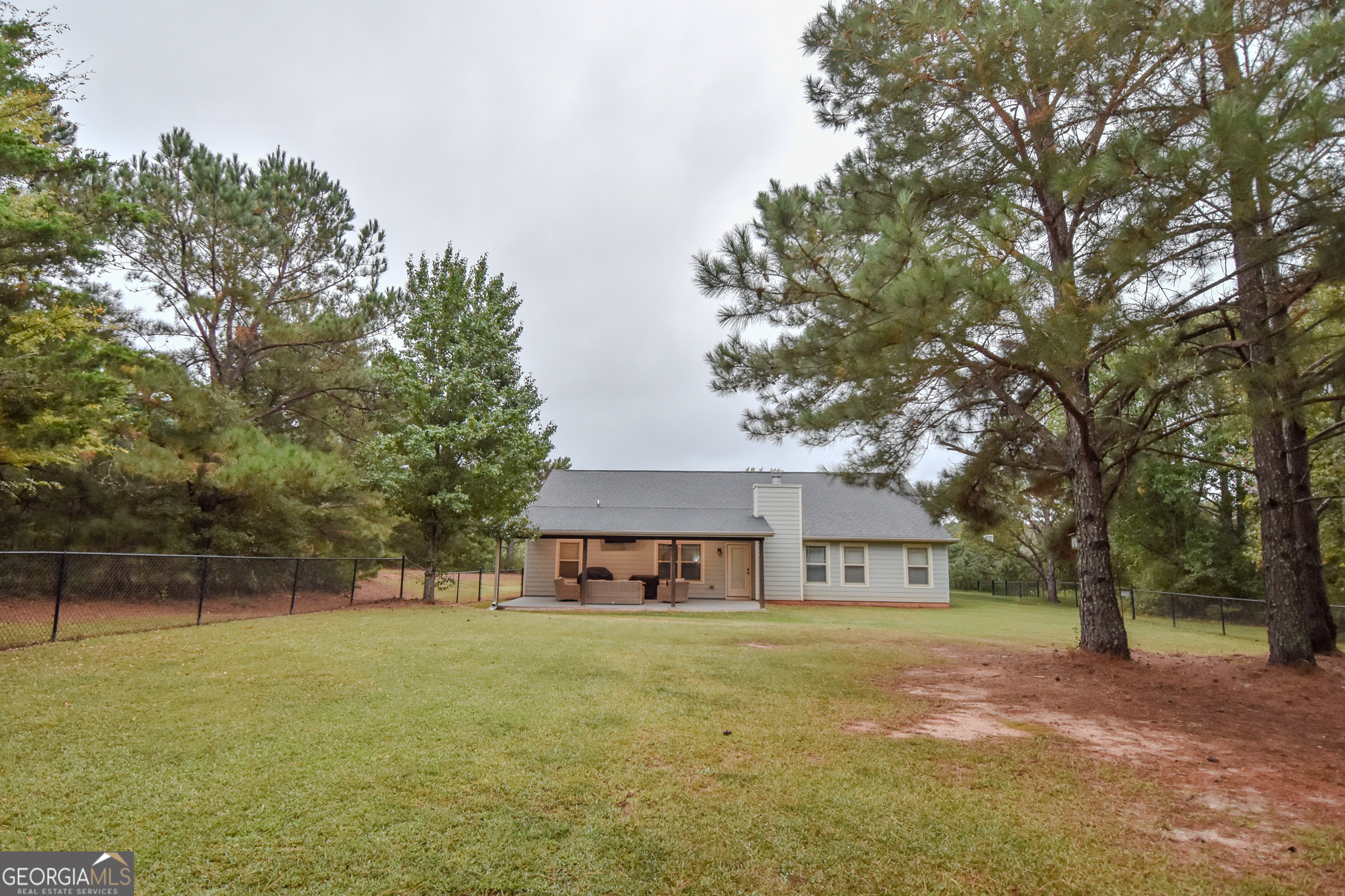 1946 Highway 362 Williamson, GA 30292 - Photo 100 of 104 a front view of a house with a garden