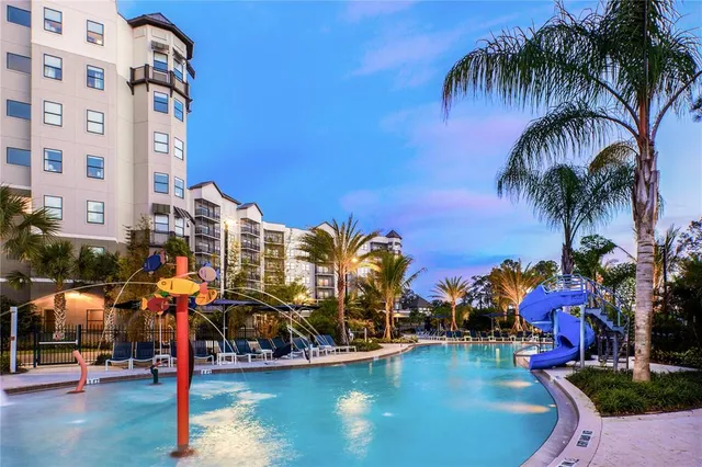 a living room with furniture a flat screen tv and rug
