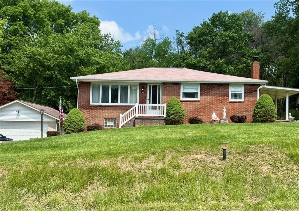 151 Huntingdon Road Wyano, PA 15695 - Photo 30 of 36 a front view of house with yard and green space