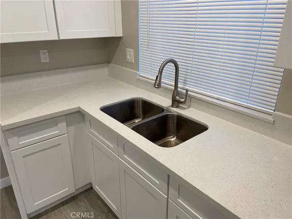 a close view of a sink and dishwasher in a kitchen