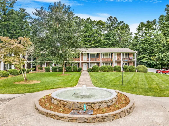 a view of a house with a backyard porch and sitting area