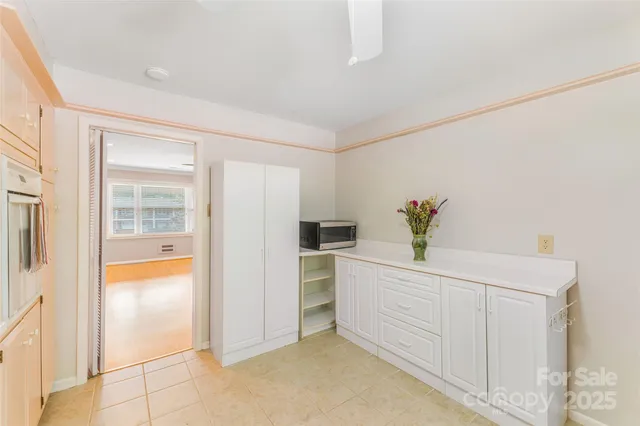 a white painted room with a window