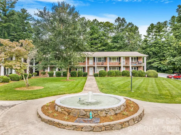 a view of a house with a backyard porch and sitting area