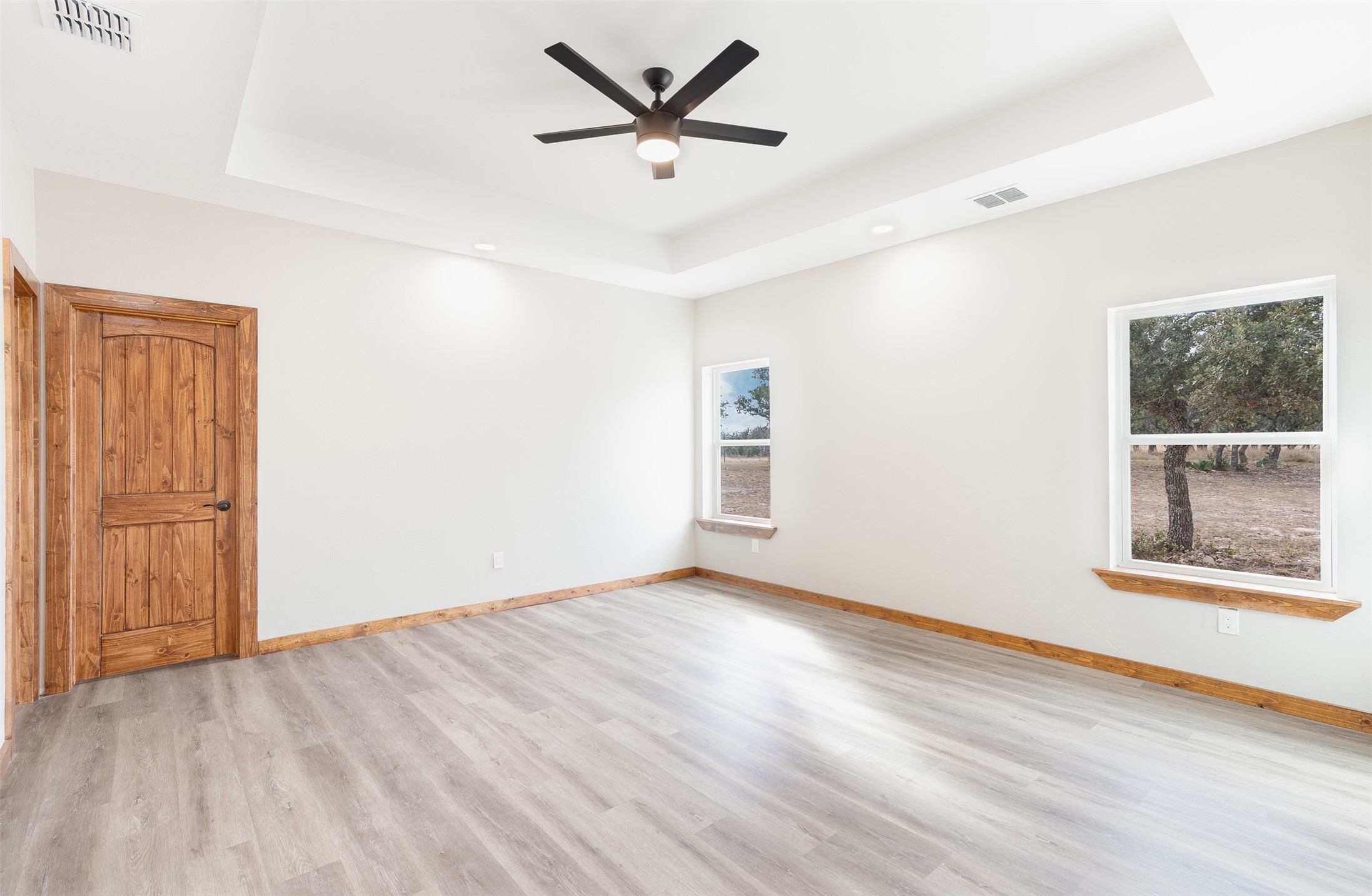 288 Nott Branch Road Harper, TX 78631 - Photo 11 of 27 wooden floor in an empty room with a window