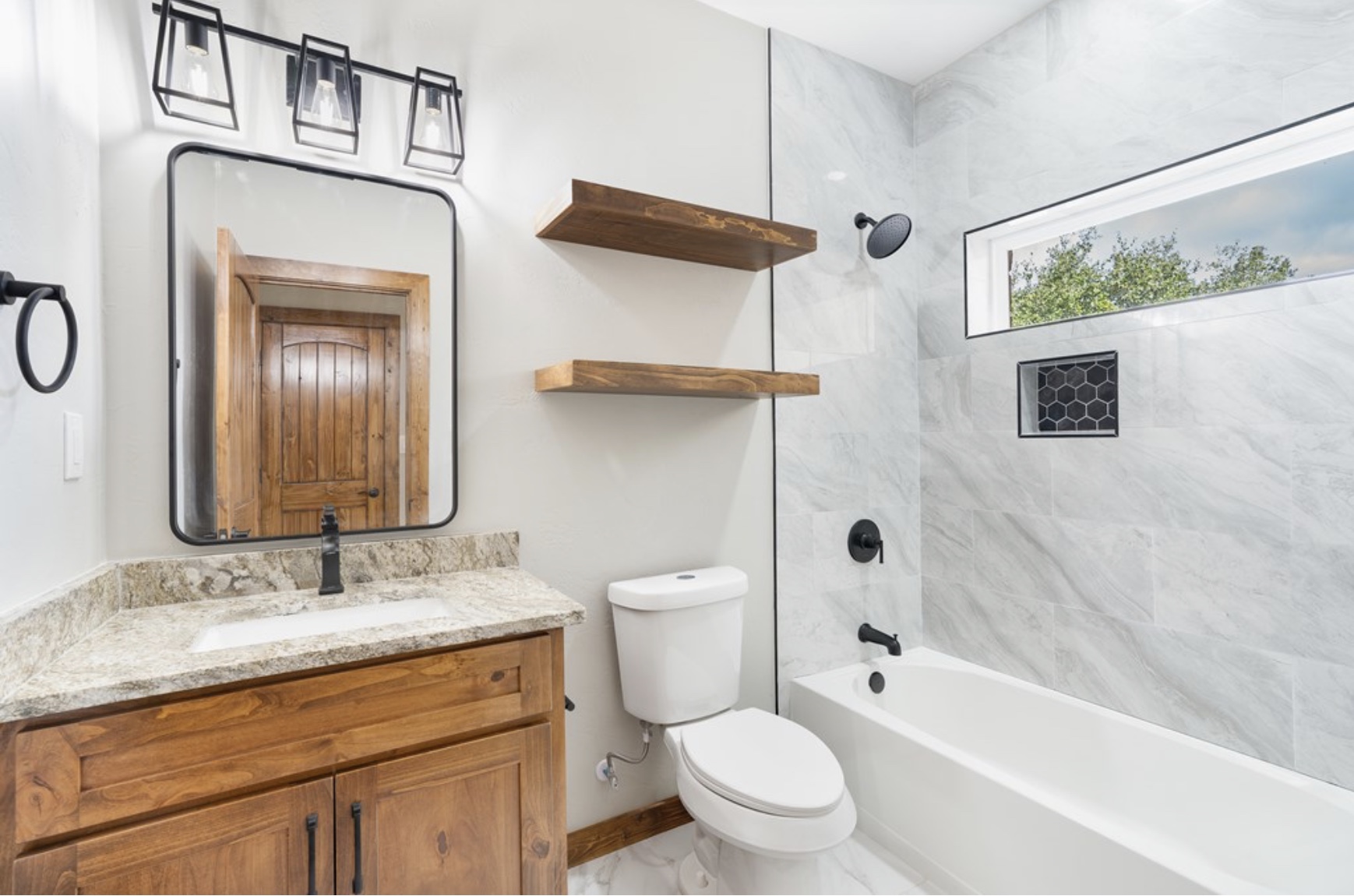 288 Nott Branch Road Harper, TX 78631 - Photo 19 of 27 a bathroom with a granite countertop sink toilet and shower