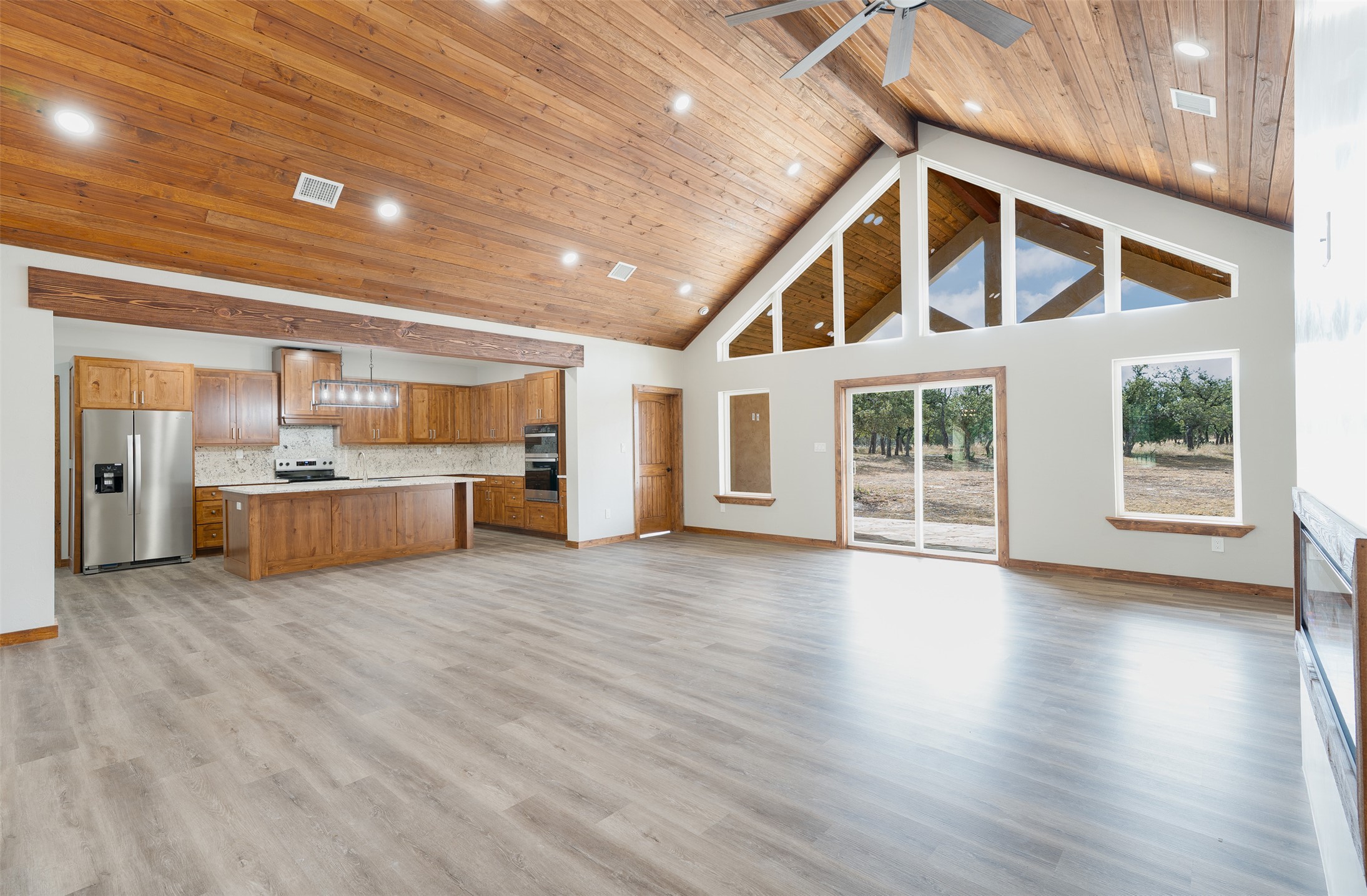 288 Nott Branch Road Harper, TX 78631 - Photo 24 of 27 a view of an empty room with window and wooden floor