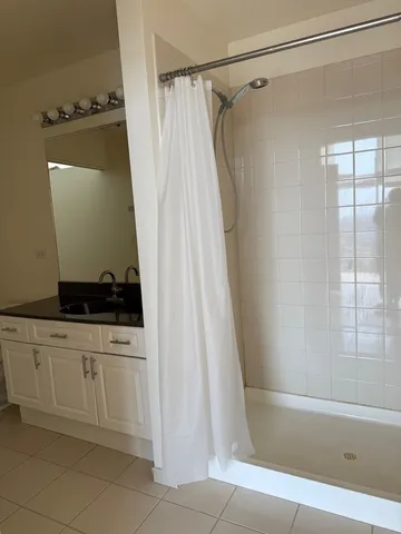 a bathroom with a bathtub and a shower