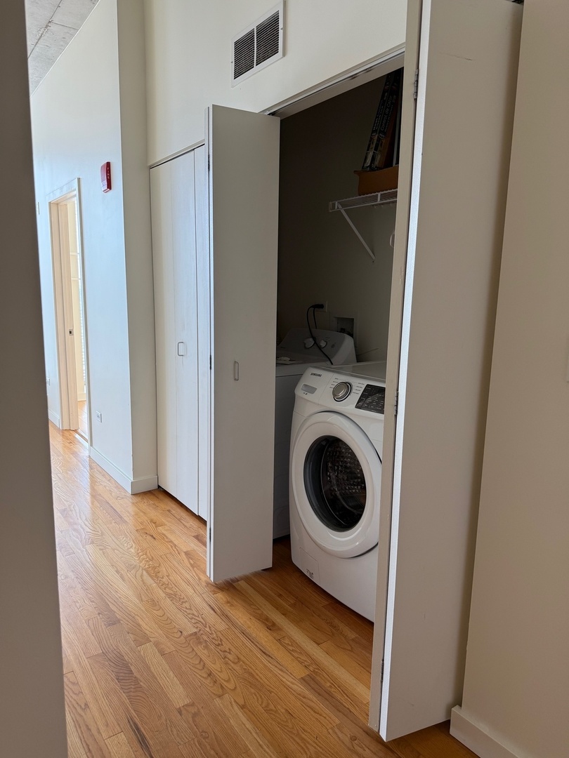 1720 South Michigan Avenue, Unit 2609 Chicago, IL 60616 - Photo 10 of 16 a view of a storage & utility room with washer and dryer