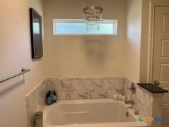 907 East 3rd Street, Unit A Lampasas, TX 76550 - Photo 12 of 13 a bathroom with a bathtub