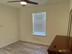 907 East 3rd Street, Unit A Lampasas, TX 76550 - Photo 7 of 13 a view of a room with a window